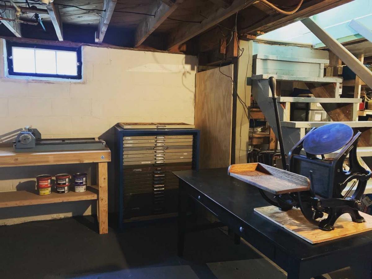 Basement studio with prinmting press and other equipment